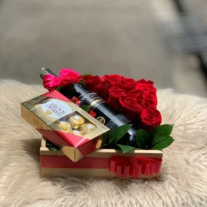Arreglo con rosas, botella de vino y chocolates Ferrero Rocher